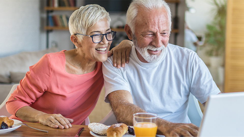 senior couple on computer